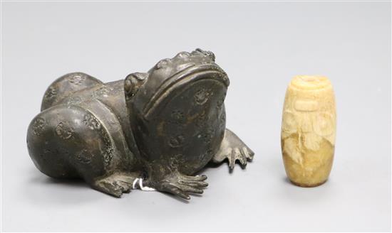 A Chinese bronze toad and a stone bead